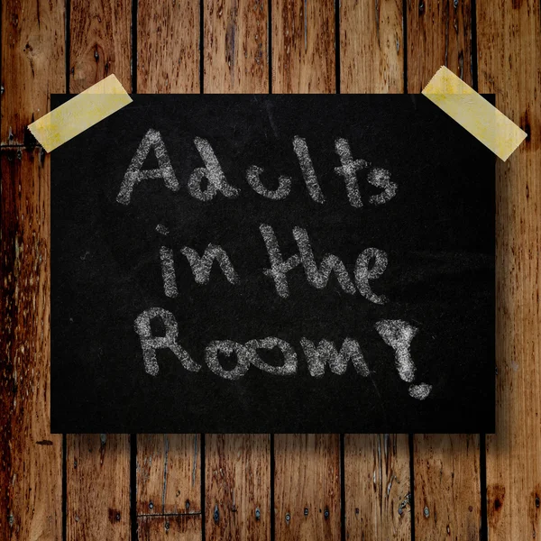 Adult in the room on message note with wooden background — Stock Photo, Image