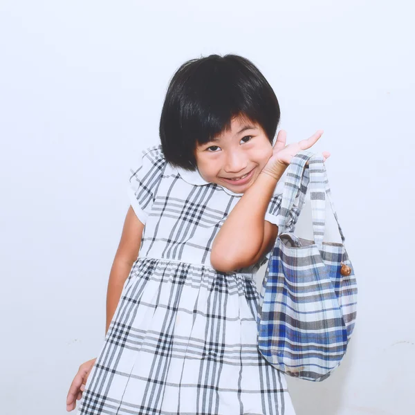 Funny Asian girl holding fabric bag in hand, process in vintage stlye — Stock Photo, Image