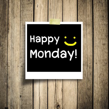 Happy Monday on grunge wooden background with copy space