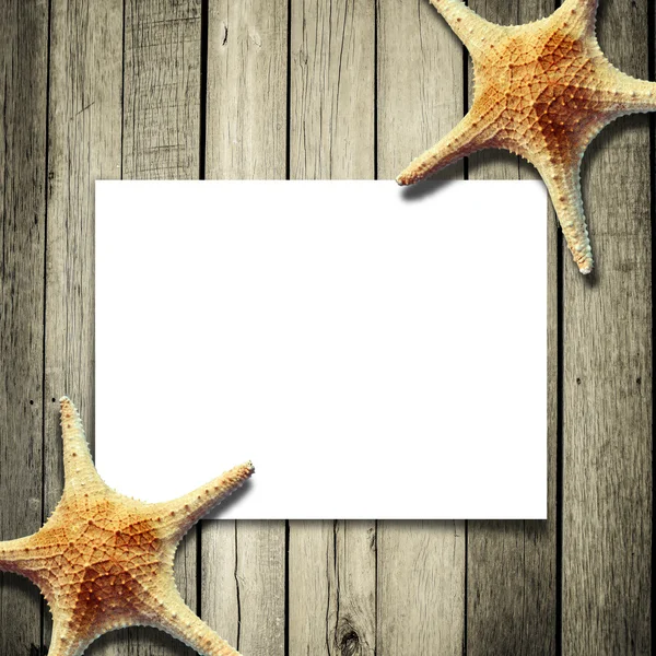 Star vis en kaart op een houten planken — Stockfoto