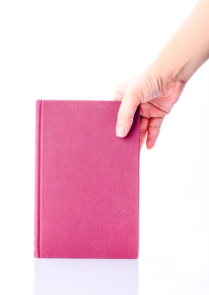 Libro rosa con mano isolata su sfondo bianco — Foto Stock