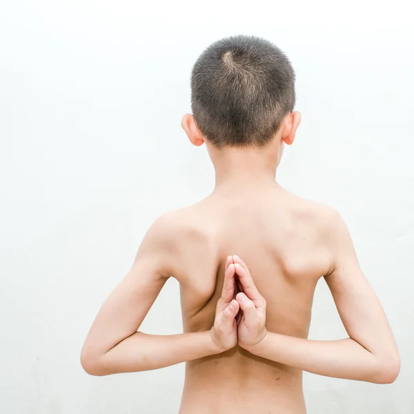 Young boy doing yoga exercise in Virasana or Hero Pose with reve — Stock Photo, Image