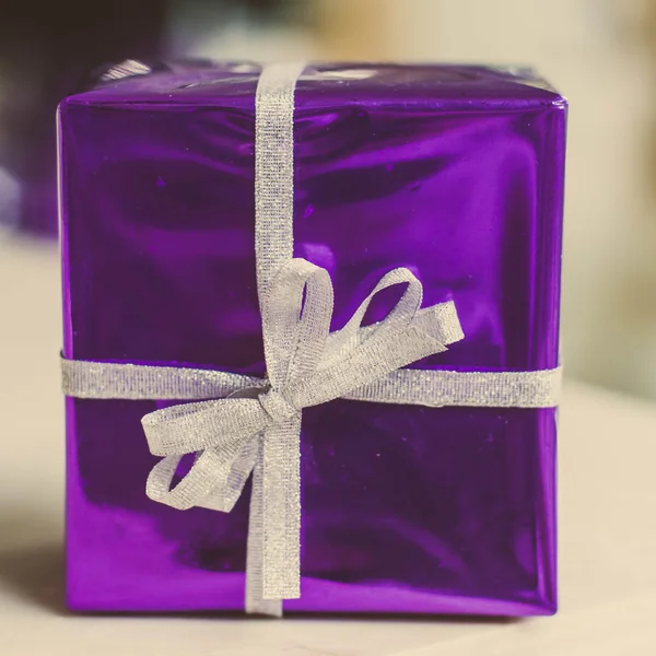 Purple present box with retro filter effect. — Stock Photo, Image