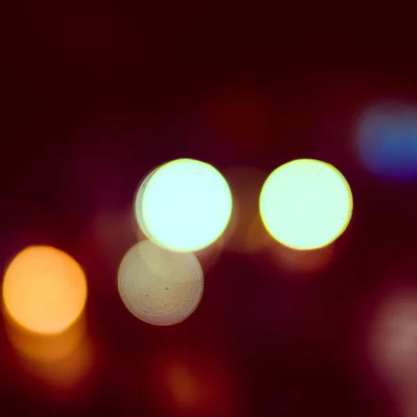 Foto de luces bokeh sobre fondo negro —  Fotos de Stock