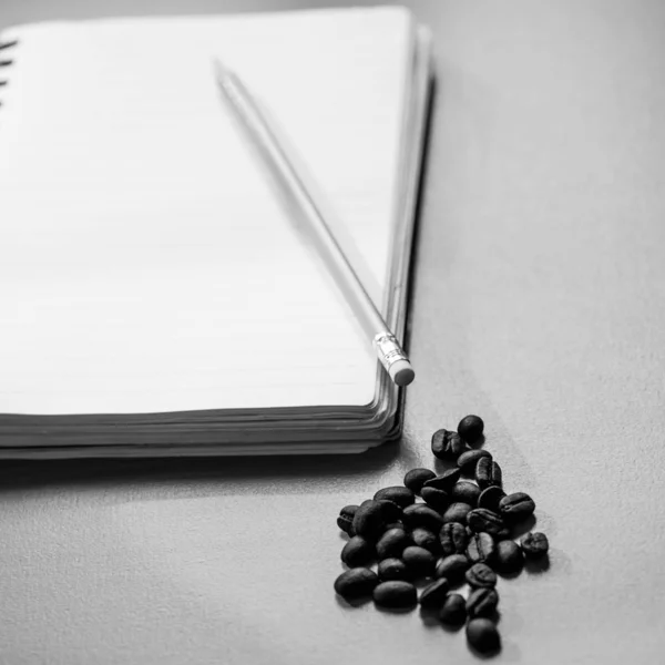 Blank notebook coffee cup on wooden background — Stock Photo, Image