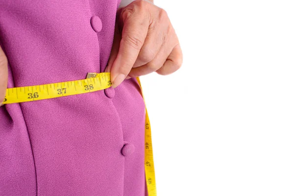 Senior woman measuring her waist by centimeter — Stock Photo, Image