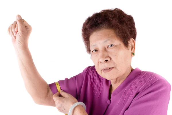 Senior woman measuring her waist by centimeter — Stock Photo, Image