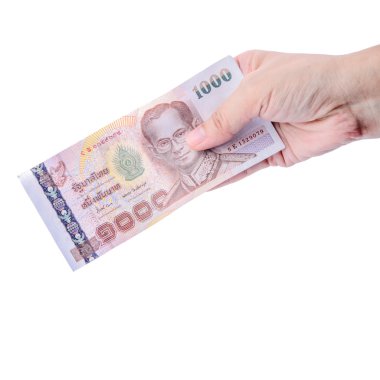 Tayland para üzerinde beyaz izole tutmak el.