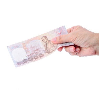 Tayland para üzerinde beyaz izole tutmak el.