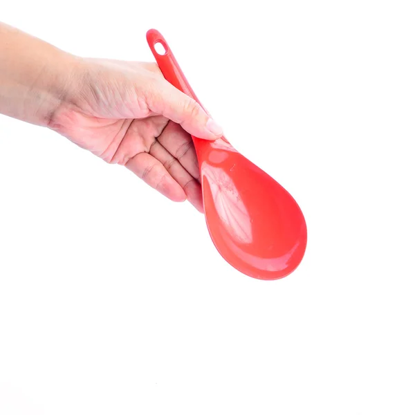 Mão segurando concha vermelha isolada no fundo branco — Fotografia de Stock