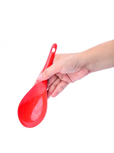 Hand holding red ladle isolated on white background — Stock Photo, Image