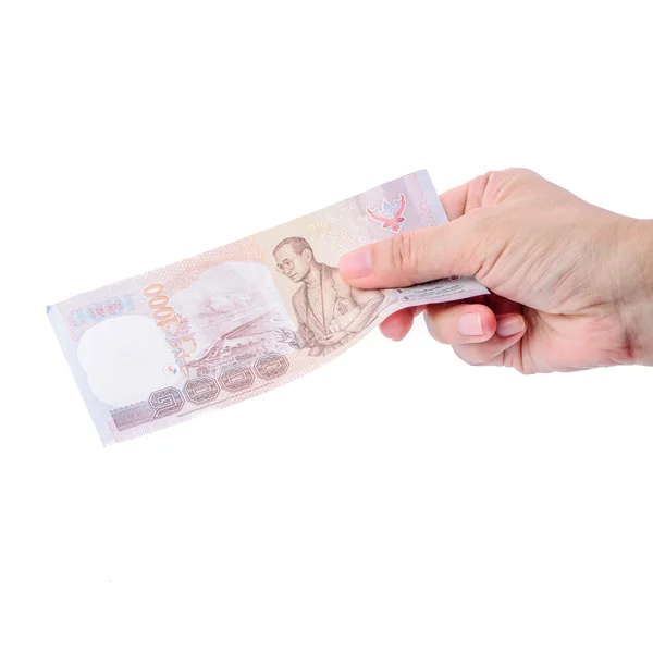 Mano sosteniendo dinero tailandés aislado en blanco . — Foto de Stock