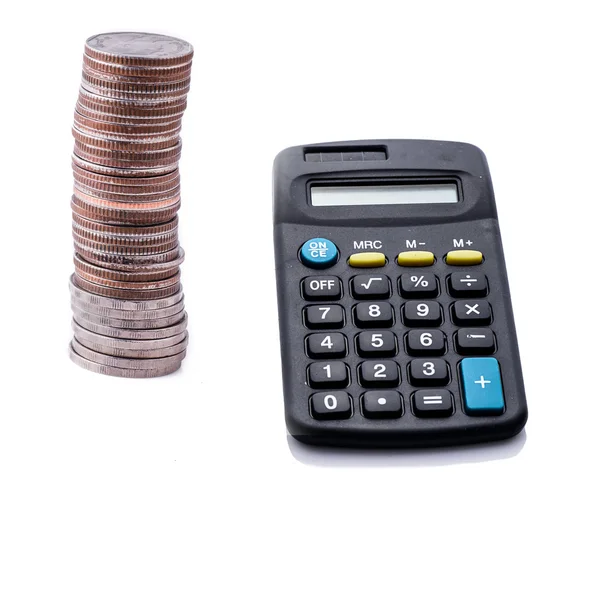 Coins and calculator on white background — Stock Photo, Image