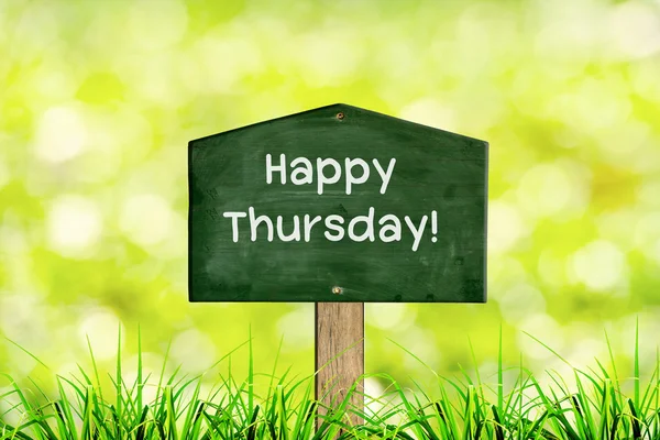 Green sign board with natural background and message Happy Thursday — Stock Photo, Image