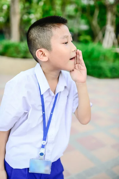 Thai school boy in uniform is shouting. — Stock Photo, Image