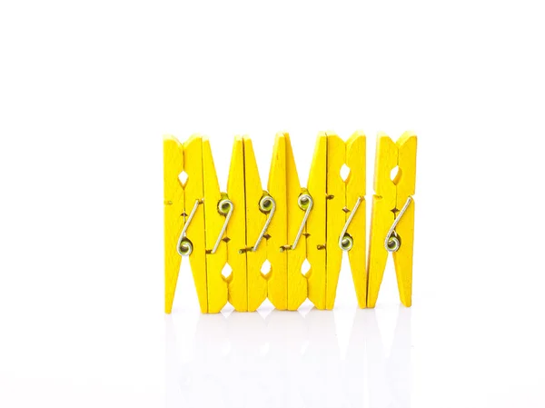 Wooden clothes pins on a white background — Stock Photo, Image