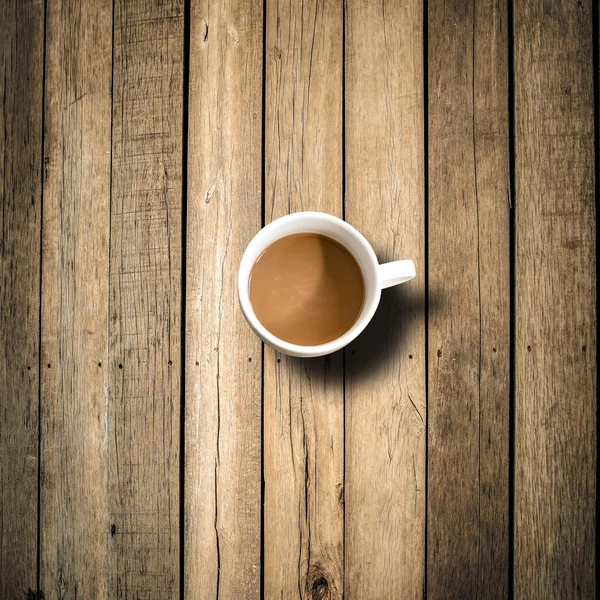 Caneca de café na mesa de madeira — Fotografia de Stock