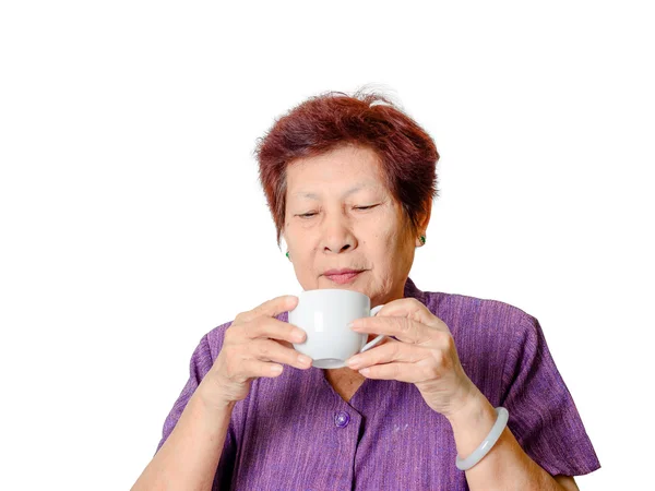 Yaşlı kadın ile bir fincan kahve ya da çay — Stok fotoğraf