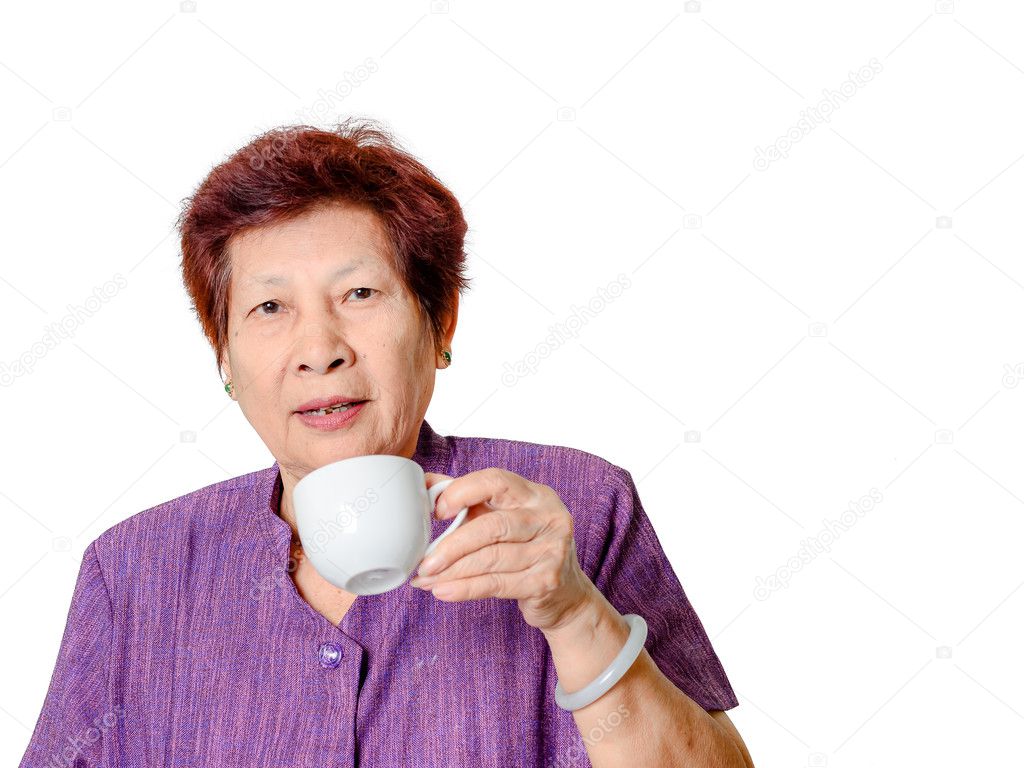 Oude vrouw met een kopje koffie of ⬇ Stockfoto, rechtenvrije foto door © Jayjaynaenae