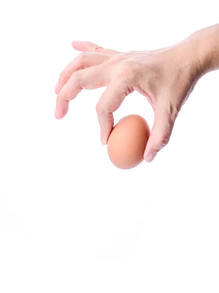 Huevo de gallina en mano de mujer aislado sobre blanco . — Foto de Stock