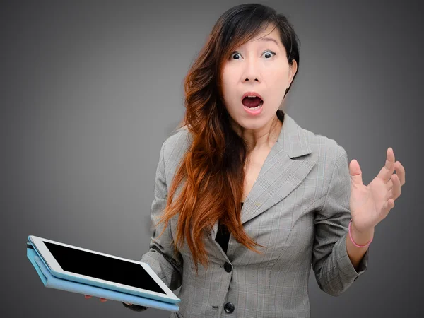 Shocked businesswoman with digital table — Stock Photo, Image