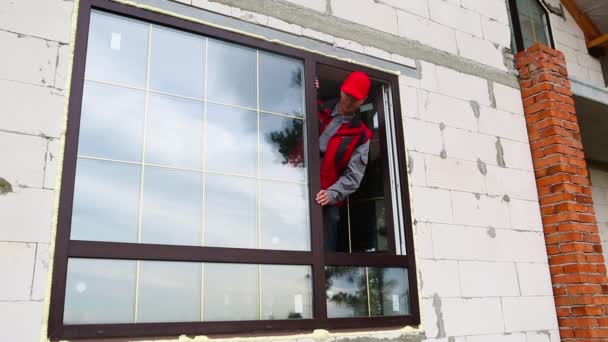 Window Installer Adjusts Hinges Checks New Windows Cottage Construction Ordering — Stock Video