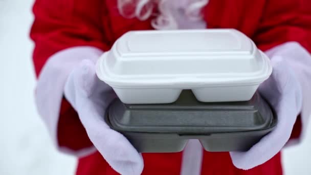 Food Delivery Service Containers Hands Santa Claus Outdoor Snow Christmas — 图库视频影像