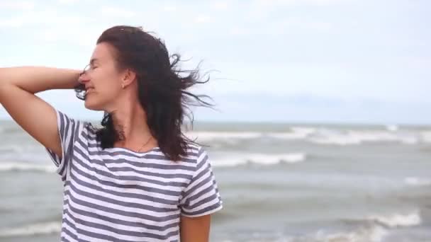 Brunette Woman Striped Dress Long Hair Fluttering Wind Stands Sea — Stock Video