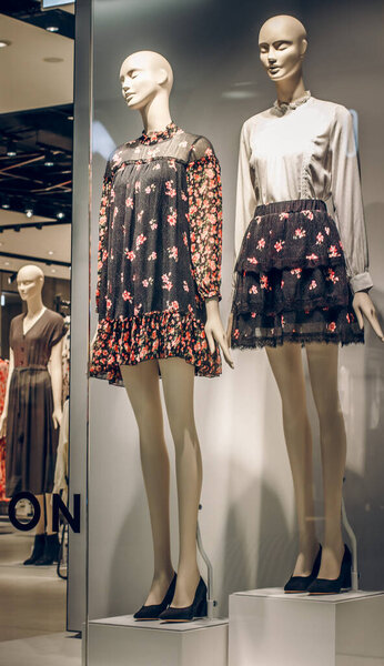 POLAND, BYDGOSZCZ - March 1, 2020: Two female mannequins show spring clothes collection. Standing dummies in store window. Female shopping