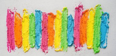 Rainbow creative background of lines drawn with multi-colored crayons. Textured bright surface