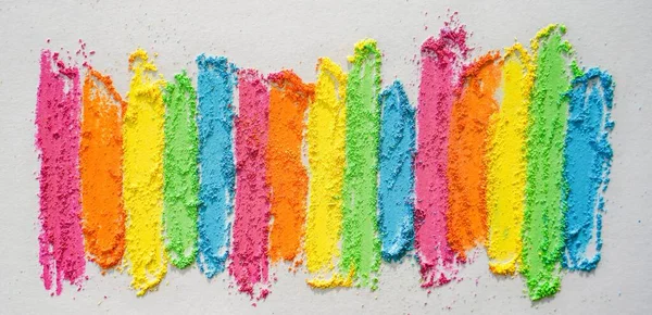 Rainbow creative background of lines drawn with multi-colored crayons. Textured bright surface