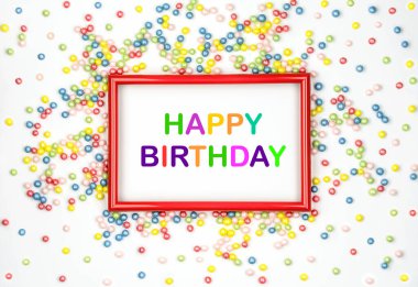 Happy Birthday. Multicolored candy and red frame on white background. Greeting card