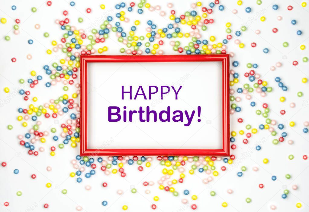 Happy Birthday. Multicolored candy and red frame on white background. Greeting card