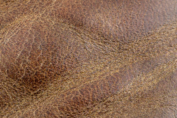 用无缝波纹棕色天然皮革制成的宏观背景 — 图库照片
