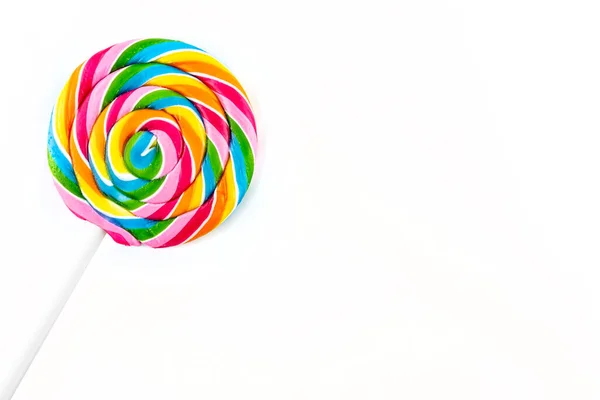 Sweet Colorful Spiral Shaped Lollipop Lying Upper Left Corner Isolated — Stock Photo, Image
