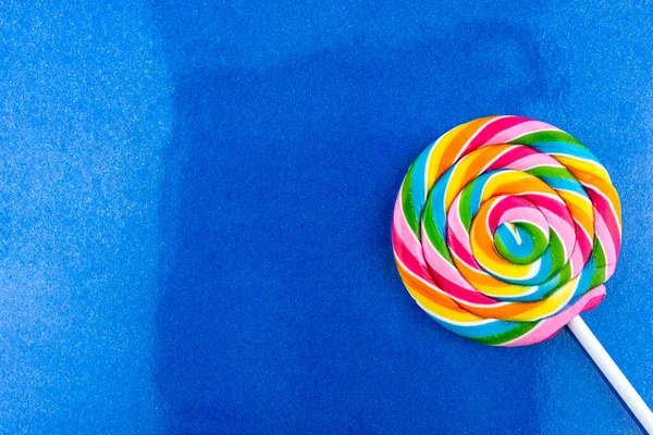 Sweet Colorful Spiral Shaped Lollipop Lying Lower Right Corner Isolated — Stock Photo, Image
