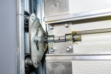 Grease lubricated double rollers in the guide for the backyard garage door, view from the inside.