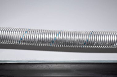Torsion spring tensioning the garage door mechanism painted blue, the gate seal is visible.