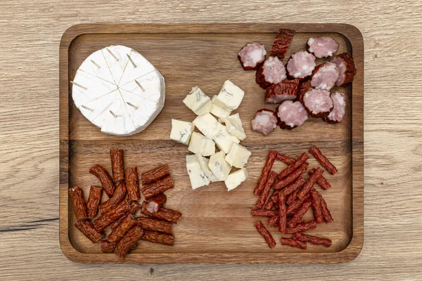 Wooden Board Delicacies Which Pieces Meat Various Types Cheese Lie — Stock Photo, Image