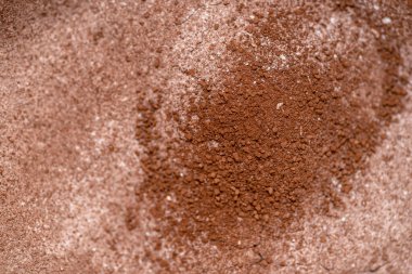 Pudra kakao ve şekerle karıştırılmış arka plan, seçici alan derinliği.