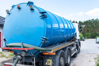 A truck with a large tank for pumping out a septic tank with a capacity of more than 20 cubic meters.