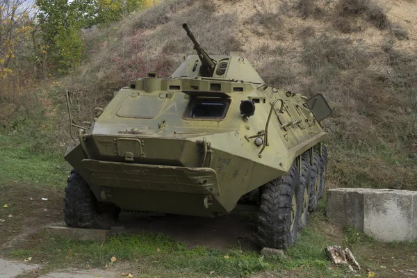 The thrown armoured troop-carrier — Stock Photo, Image