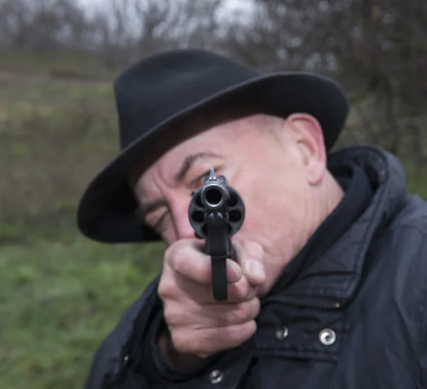 Man aiming a gun Nagan — Stock Photo, Image