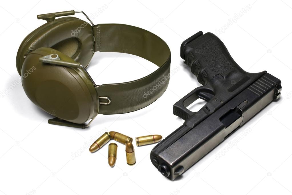 Pistol, ear protection and ammunition. Isolated on white. 3 separate clipping paths: pistol, earmuffs, ammo and 1 complete for all objects.