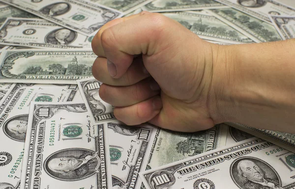 Money (federal reserve notes) and fist — Stock Photo, Image