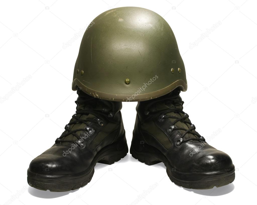 Soldier: military boots and helmet. Isolated on white background. Clipping path (without shadow).