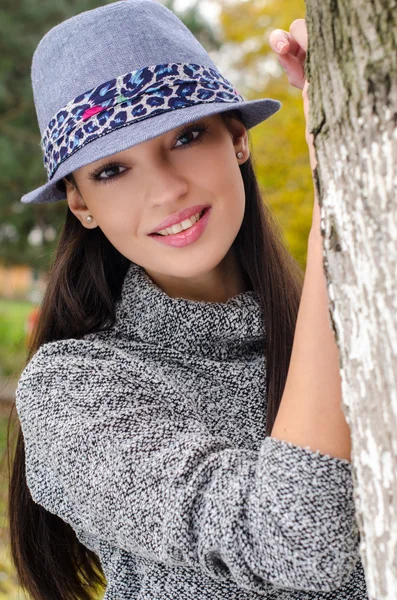 Sexy young brunette girl with hat. — Stock Photo, Image