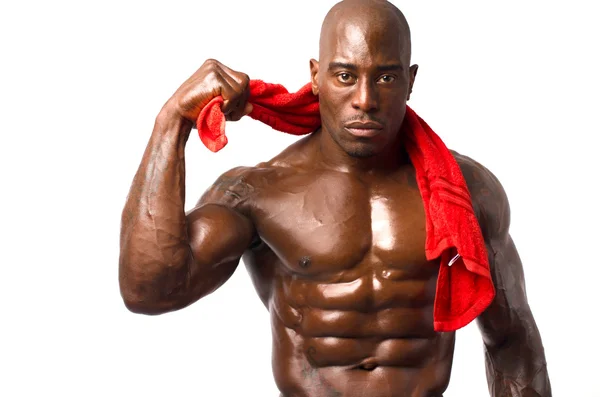 Forte fisiculturista homem com abdominais perfeitos, ombros, bíceps, tríceps e peito — Fotografia de Stock