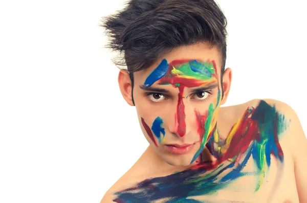 Schöner junger Mann ins Gesicht gemalt — Stockfoto