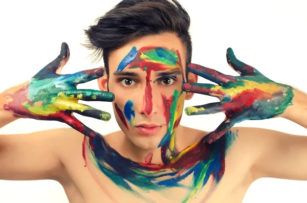 Hermoso joven pintado en la cara — Foto de Stock